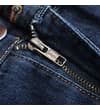 Thumbnail Close-up of zip fly on dark wash jeans.